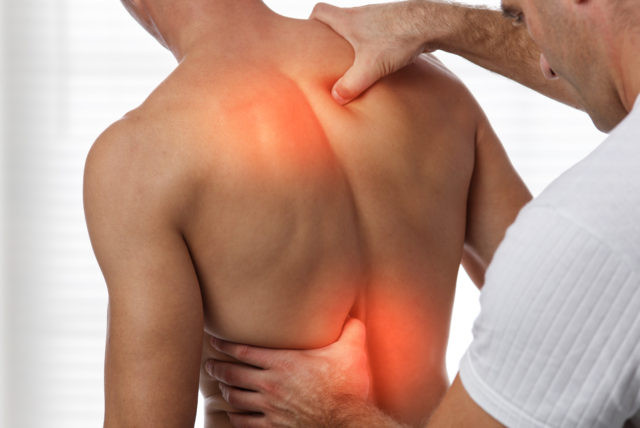 Patient receiving spinal decompression therapy for herniated disc pain relief and spinal health support